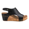 Heel Yeah Boutique Carly wedge sandal in black faux leather with a cork-style platform and decorative gold studs.