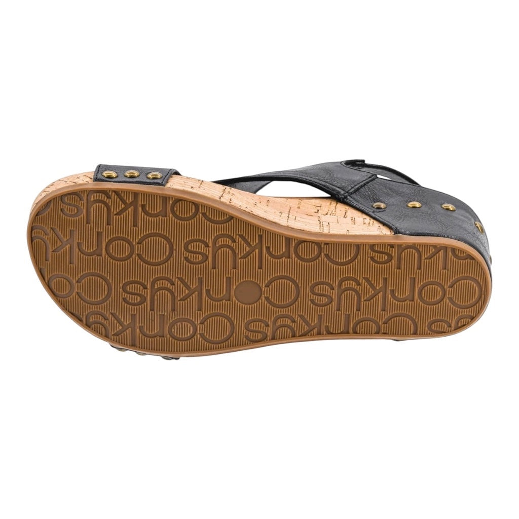 Heel Yeah Boutique Carly wedge sandal featuring a black strap with gold studs and a textured cork-style sole