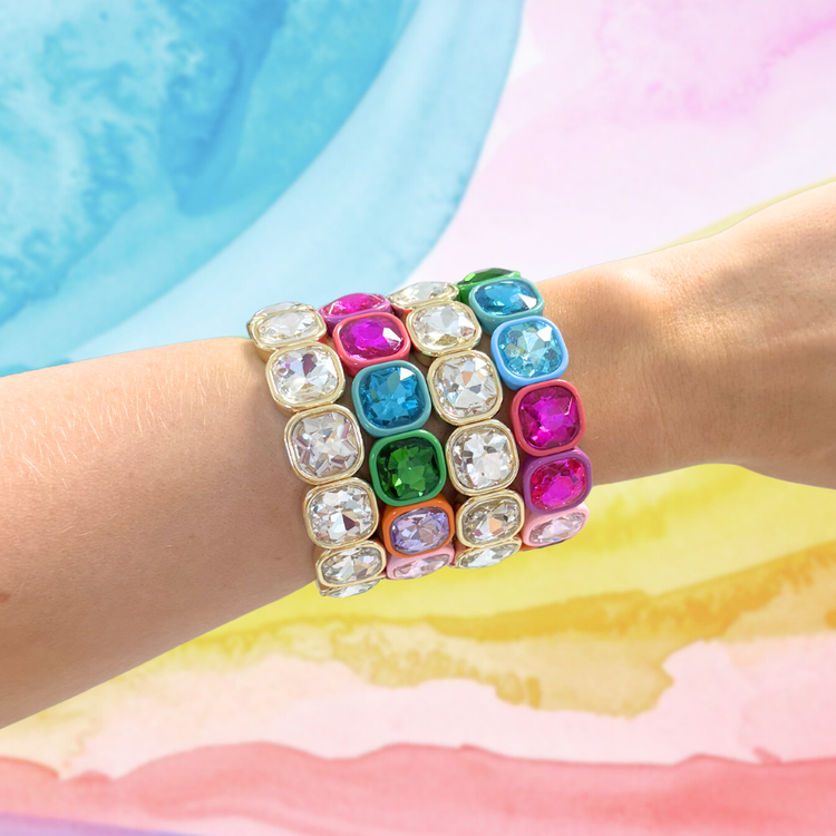 Heel Yeah Boutique Frankie Bracelet featuring multi-colored square crystal links on a wrist against a pastel backdrop