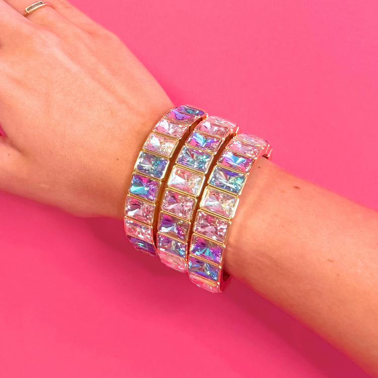 Heel Yeah Boutique Misty bangle bracelet featuring iridescent rectangular crystals set in gold on a wrist