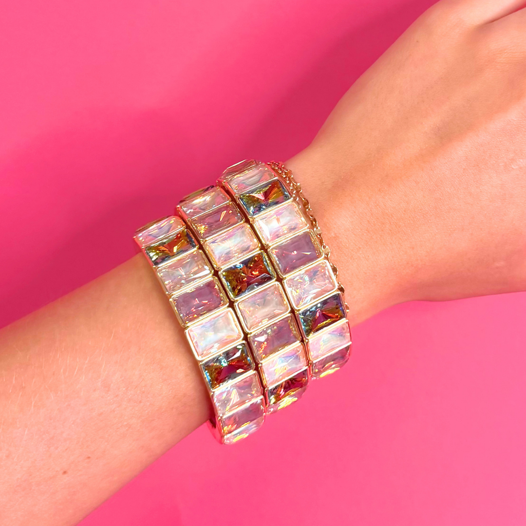 Heel Yeah Boutique Misty Bracelet featuring iridescent rectangular crystals on a gold-tone bangle worn on a wrist.