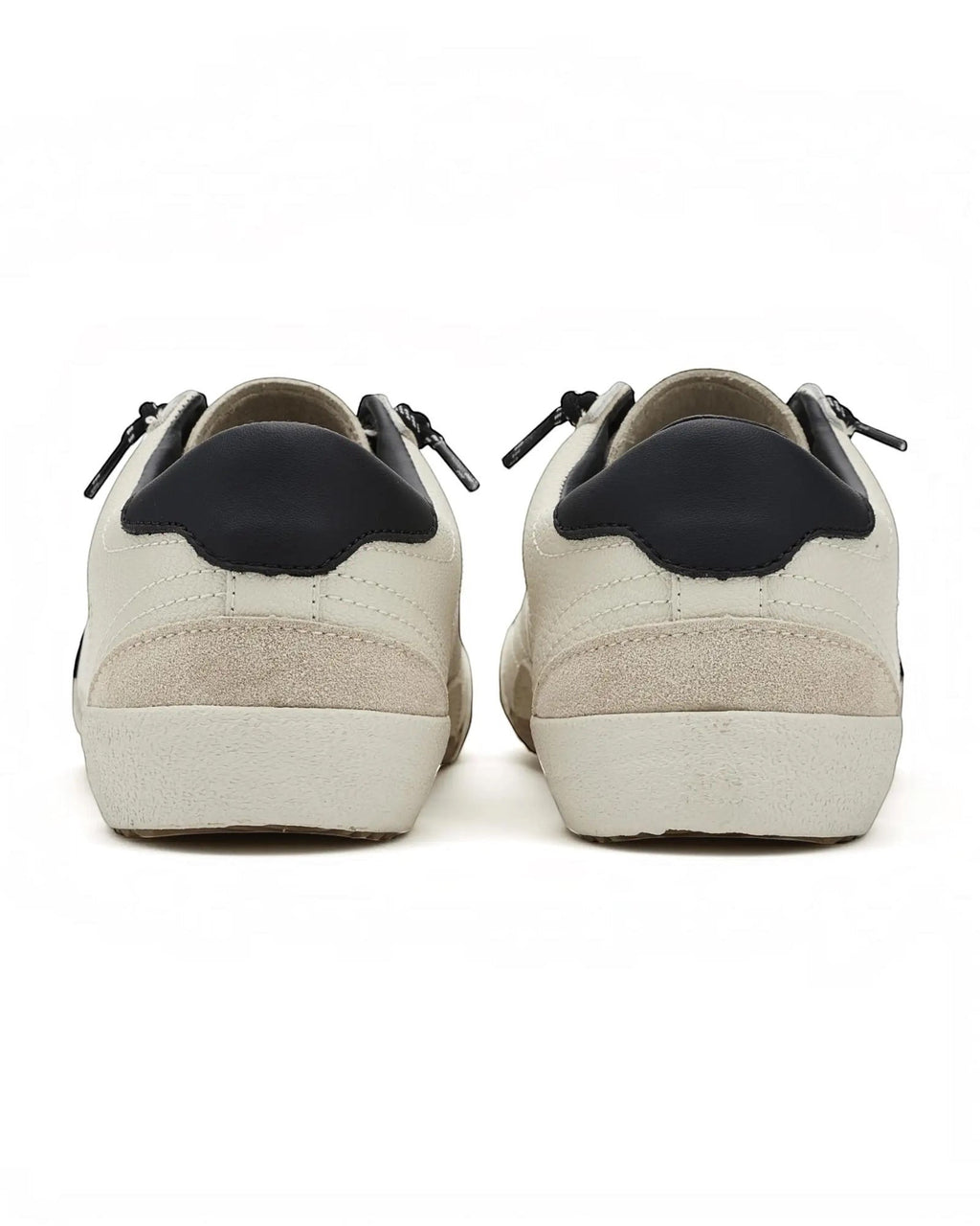 Heel Yeah Boutique Vintage Havana Legend slip-on sneakers in off-white leather and suede with black heel tabs.