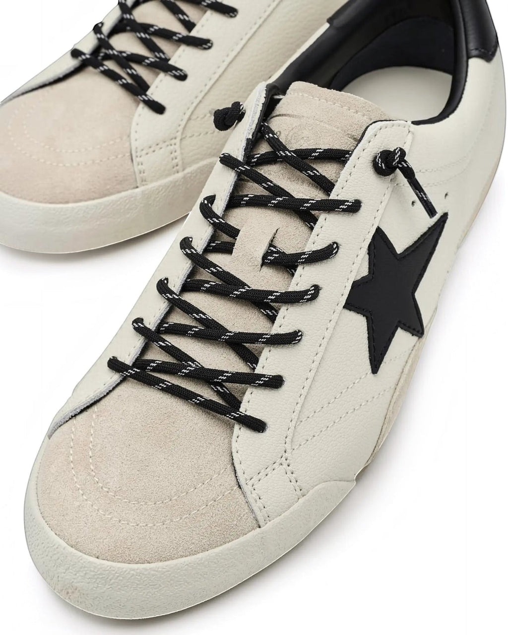 Heel Yeah Boutique Vintage Havana Legend sneakers in off-white leather and suede with a black star and slip-on laces.