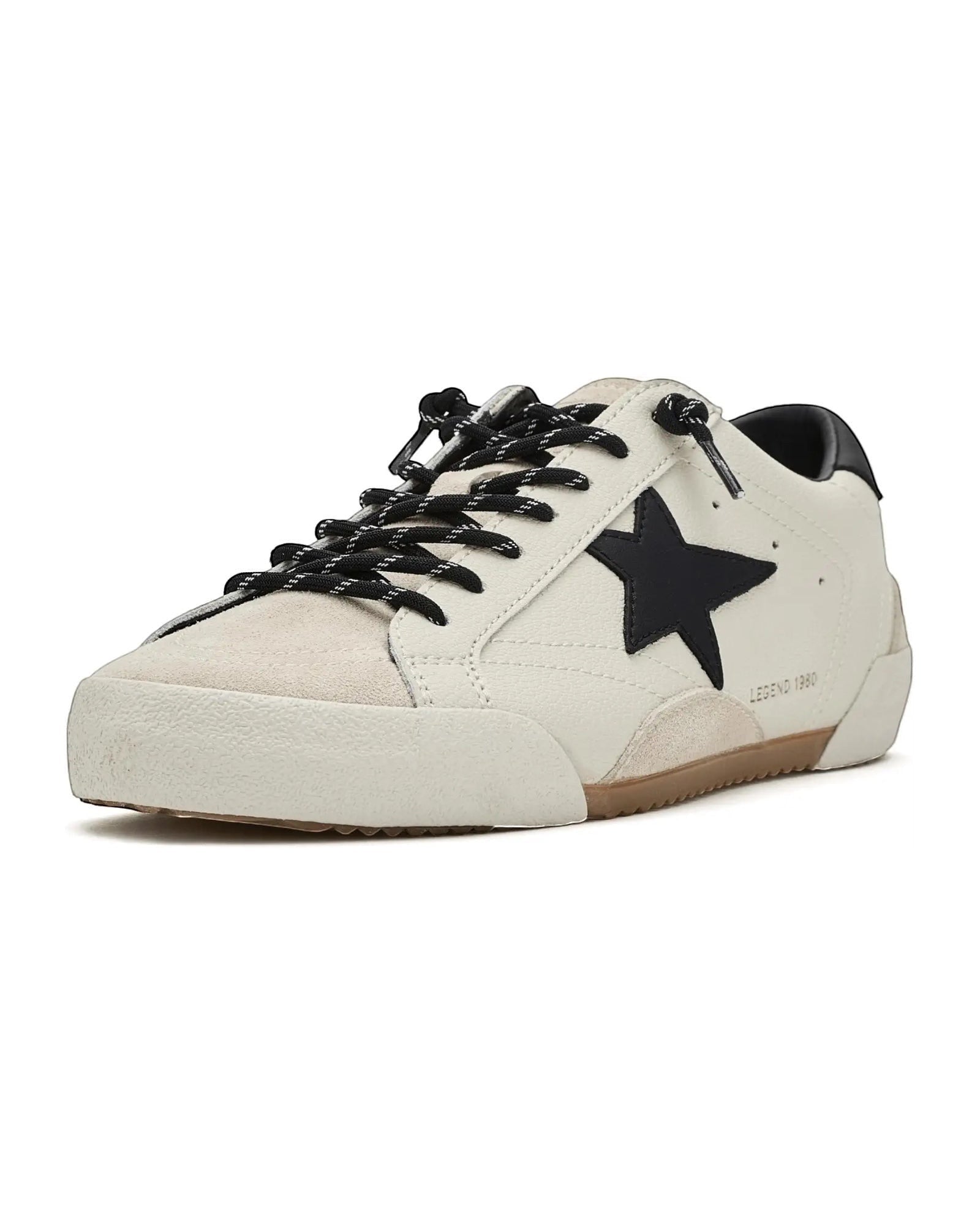 Heel Yeah Boutique Vintage Havana Legend sneakers in white leather and suede with a black star and slip-on design.
